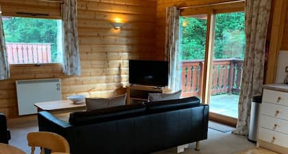 Log cabin with veranda, nestled in Kenwick Park, Louth