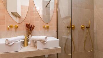 Shower, hair dryer, towels, shampoo
