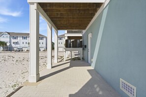 A covered outdoor area with a brick floor, white pillars, and a wooden ceiling. - NEW LISTING! Lost Key Golf & Beach Club ~Kokomo - NO HASSLE CHECK OUT (Pensacola)