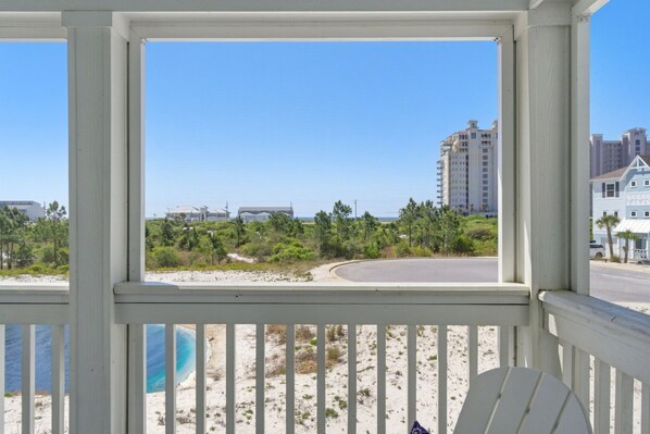 A view from a balcony with a beach and buildings in the background. - NEW LISTING! Lost Key Golf & Beach Club ~Kokomo - NO HASSLE CHECK OUT (Pensacola)