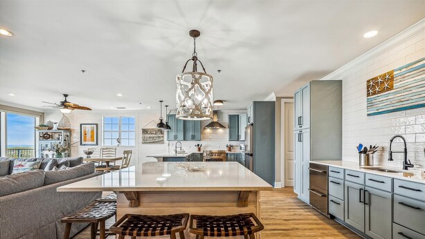 A spacious kitchen with a large island, modern appliances, and a view of the outdoors. - SAILMAKER 1001 - Ole River Views -NO HASSLE CHECK OUT (Pensacola)