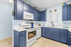 Fridge, microwave, oven, stovetop - Sandy Key 128 Ground Floor Condo- Beachfront- NO HASSLE CHECK OUT (Pensacola)