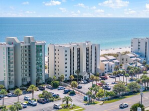Shipwatch A204- Beachfront rental property nestled among palm trees with direct access to pristine white sand and turquoise Gulf waters—just steps from your door.