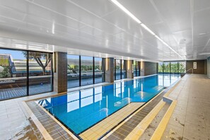 Swim and enjoy the expansive views of the surrounding landscape from this indoor pool area.