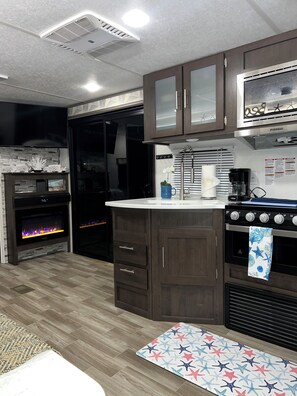 Fridge, microwave, stovetop, coffee/tea maker