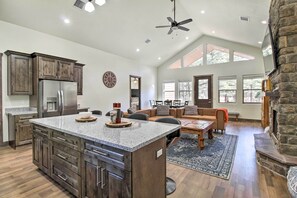 Enjoy a cozy atmosphere in the living area with a fireplace and comfortable seating.