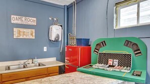 A kitchen with a sink, a refrigerator, and a green appliance with a display. - Spacious Unit Sleeps 9 + Game Room! 15 Mins from New Bills Stadium (West Seneca)