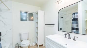 Bathtub, hair dryer, towels