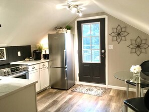 Fridge, microwave, oven, stovetop - The Cupboard Above the Stairs (Long View)
