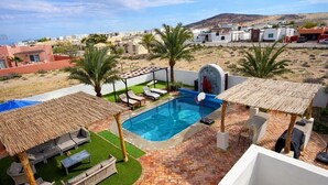 A rooftop pool area with a view of the surrounding landscape, including buildings and hills. - Casa Marimar with private heated pool at Laguna Shores Resort (Puerto peñasco)