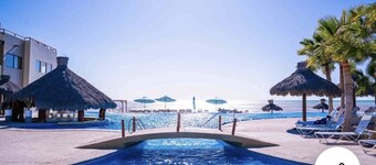 Oceanfront ground level condo on a Private Beach in a lovely resort!