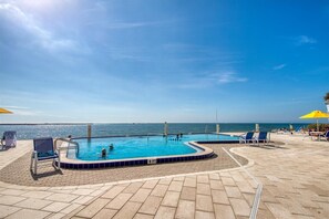 Outdoor pool, a heated pool - Sea Side condo with waterfront Sunset Views. Walkable to everything! (Clearwater)