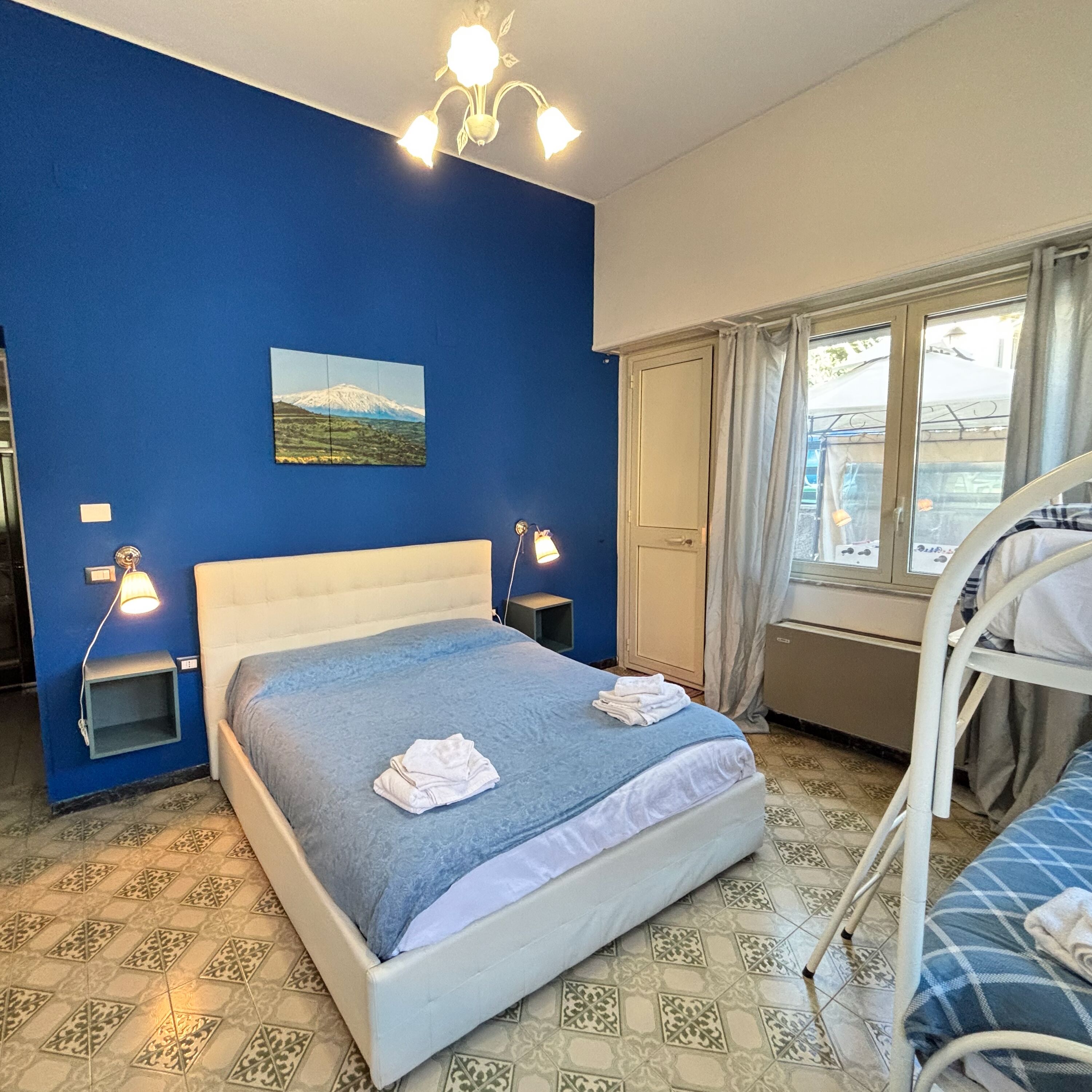 Deluxe Quadruple Room | Premium bedding, down comforters, pillowtop beds, minibar