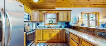 Dog-friendly lakefront house with hot tub, central AC, & mountain view