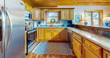 Dog-friendly lakefront house with hot tub, central AC, & mountain view