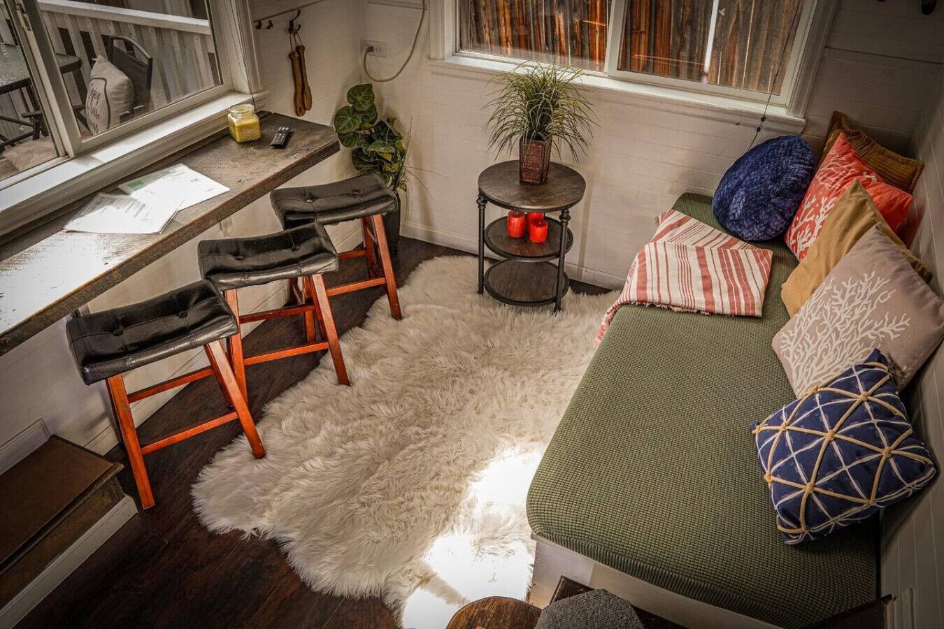 Relax on vibrant cushions while soaking in light and mountain views!