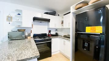 Fridge, microwave, stovetop, coffee/tea maker