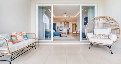 Stylish, ocean-view condo on ground floor with pool, washer/dryer, & patio