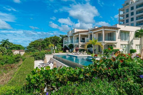 Stylish, ocean-view condo on ground floor with pool, washer/dryer, & patio