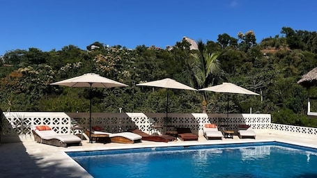 Outdoor pool, open 8:00 AM to 9:30 PM, free cabanas, pool umbrellas