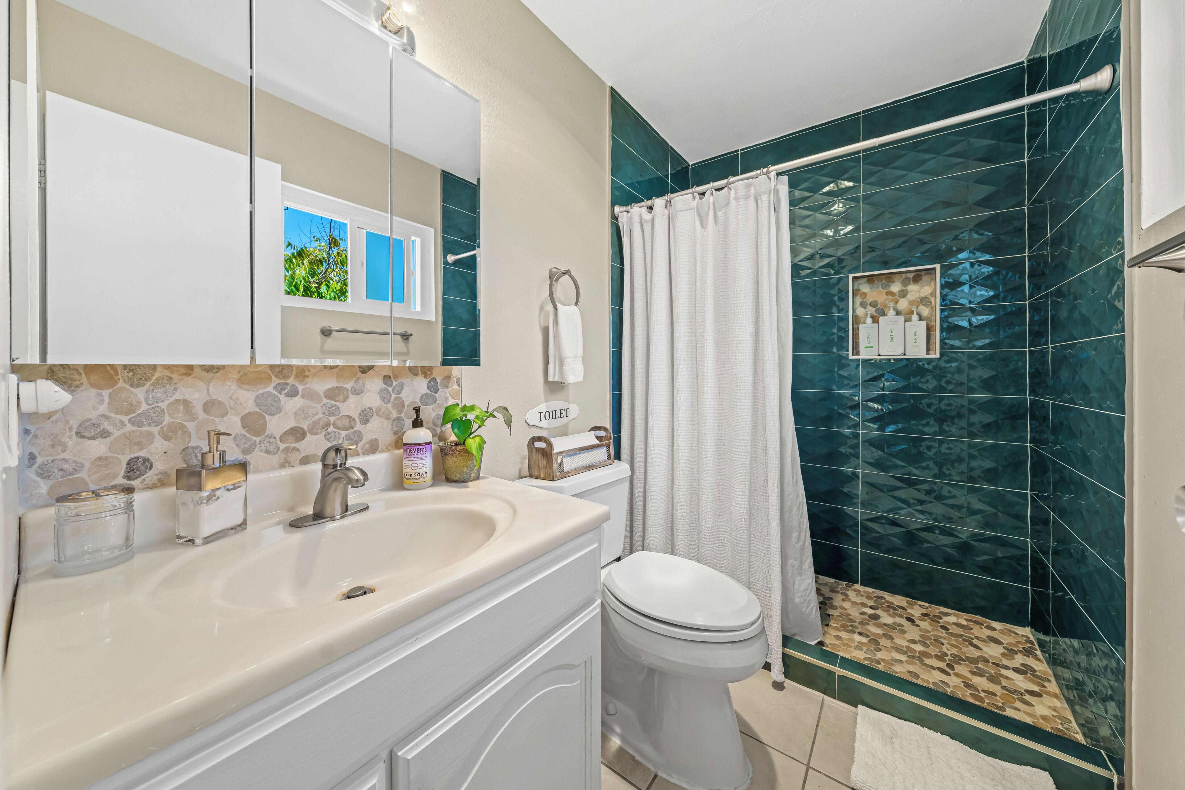 Bathtub, hair dryer, towels, soap