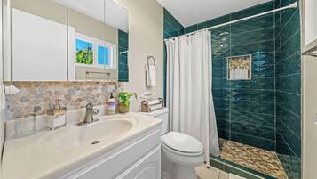 Bathtub, hair dryer, towels, soap