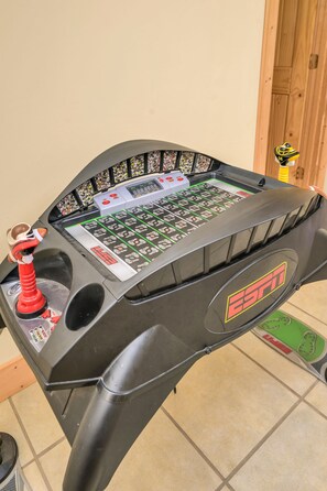 A control panel with a digital display, buttons, and a joystick.
