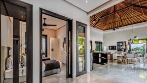 A spacious living area with a high ceiling and a modern design. - The Residence Seminyak (Seminyak)