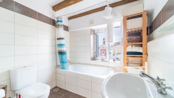 Bathtub, hair dryer, towels