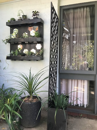 Exterior detail. Agapantha Cottage - Country in the City, original artwork, wkly/mthly discounts