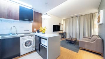 Premium Room | Living area | 43-inch LCD TV with digital channels, TV
