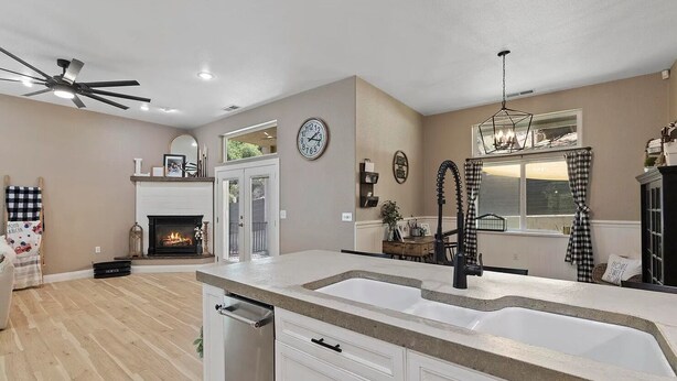 A modern kitchen with a large island, a built-in oven, and a fireplace. - Spacious-Gourmet Kitchen-Luxe King Bed-Ping Pong-Arcade (Sonora)