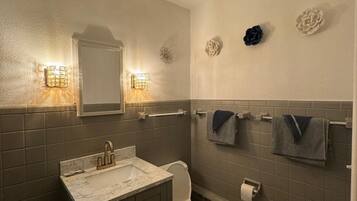 Shower, rainfall showerhead, hair dryer, towels