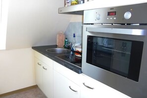 Fridge, oven, dishwasher, high chair
