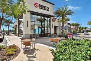Enjoy dining at this modern restaurant with large windows and outdoor seating.