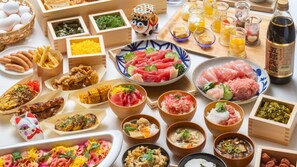 A variety of Japanese dishes arranged on a table, including sushi, sashimi, and other traditional foods. - VESSEL INN ASAKUSA TSUKUBA EXPRESS (Tokyo)
