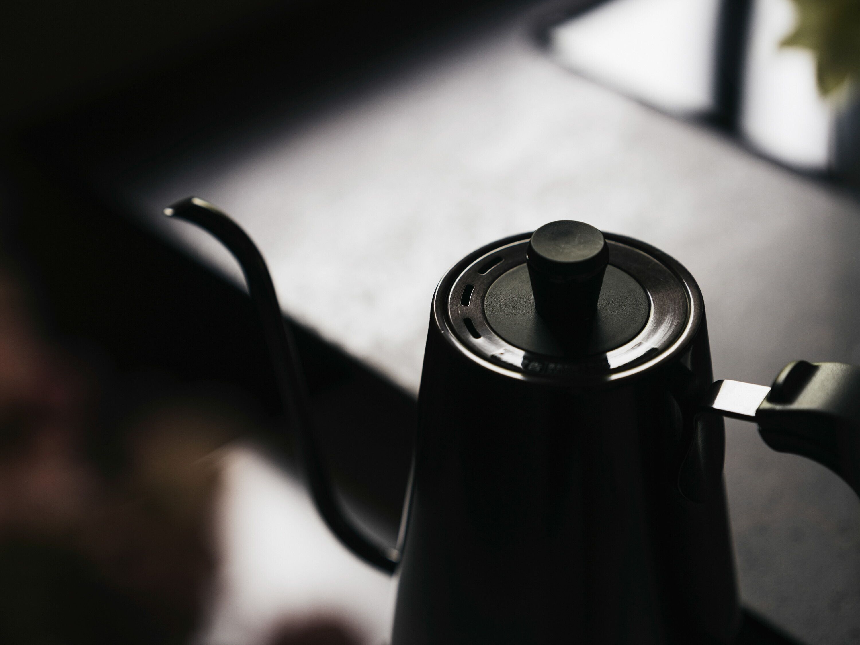 A close-up of a coffee maker on a countertop.