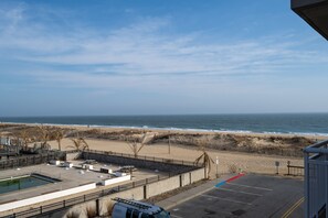 Enjoy ocean views from our beachfront hotel, featuring a pool, lifeguard stand, and beach access.