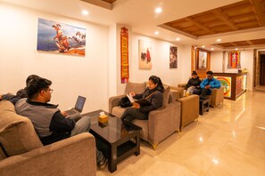 A lobby with sofas, a coffee table, and artwork on the walls. - Hotel Ama-La, The Heart of Comfort in Thamel (Kathmandu)