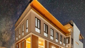 A multi-story hotel with a modern design, featuring balconies and large windows. - Hotel Ama-La, The Heart of Comfort in Thamel (Kathmandu)