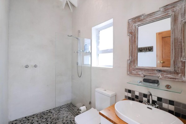 Bathtub, hair dryer, soap, shampoo
