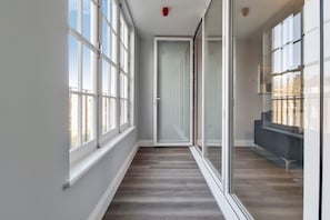 Enjoy the serene view from the entrance, where a comfortable bench invites you to sit and unwind.