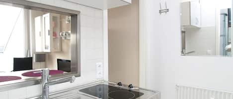 Fridge, stovetop, dishwasher, coffee/tea maker