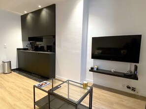 Fridge, microwave, coffee/tea maker, cookware/dishes/utensils