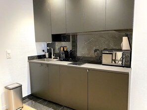 Fridge, microwave, stovetop, coffee/tea maker