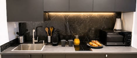 Fridge, microwave, stovetop, coffee/tea maker