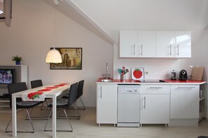 Fridge, stovetop, dishwasher, coffee/tea maker