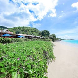 On the beach, white sand, sun-loungers, beach umbrellas