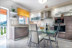 Fridge, microwave, oven, stovetop - A seafront villa with swimming pool (Achlia)