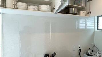 Fridge, microwave, stovetop, cookware/dishes/utensils